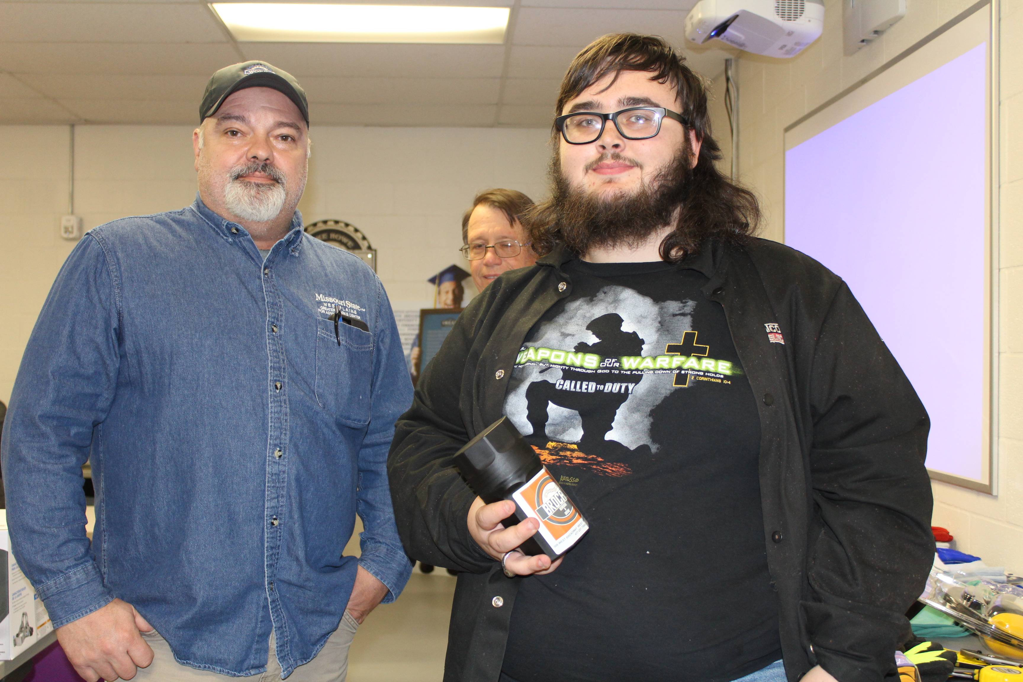 Student with chuck at welding competition 2022